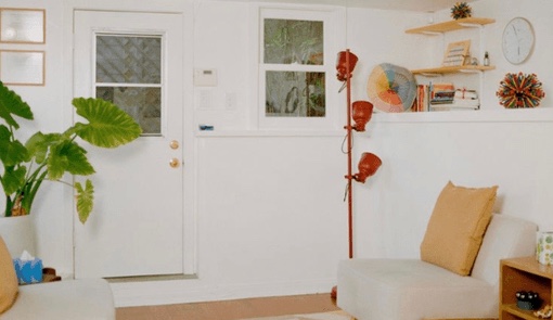 Jaye Fishel’s Echo Park office in Los Angeles: two cream armchairs facing each other, a large-leaf plant and a patterned rug